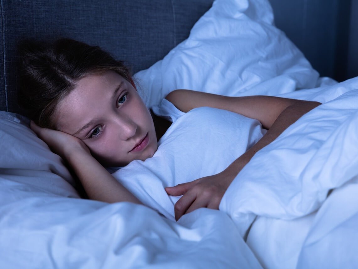 Person awake in bed during a difficult night