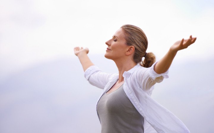 Woman enjoying a calm outdoor wellness moment